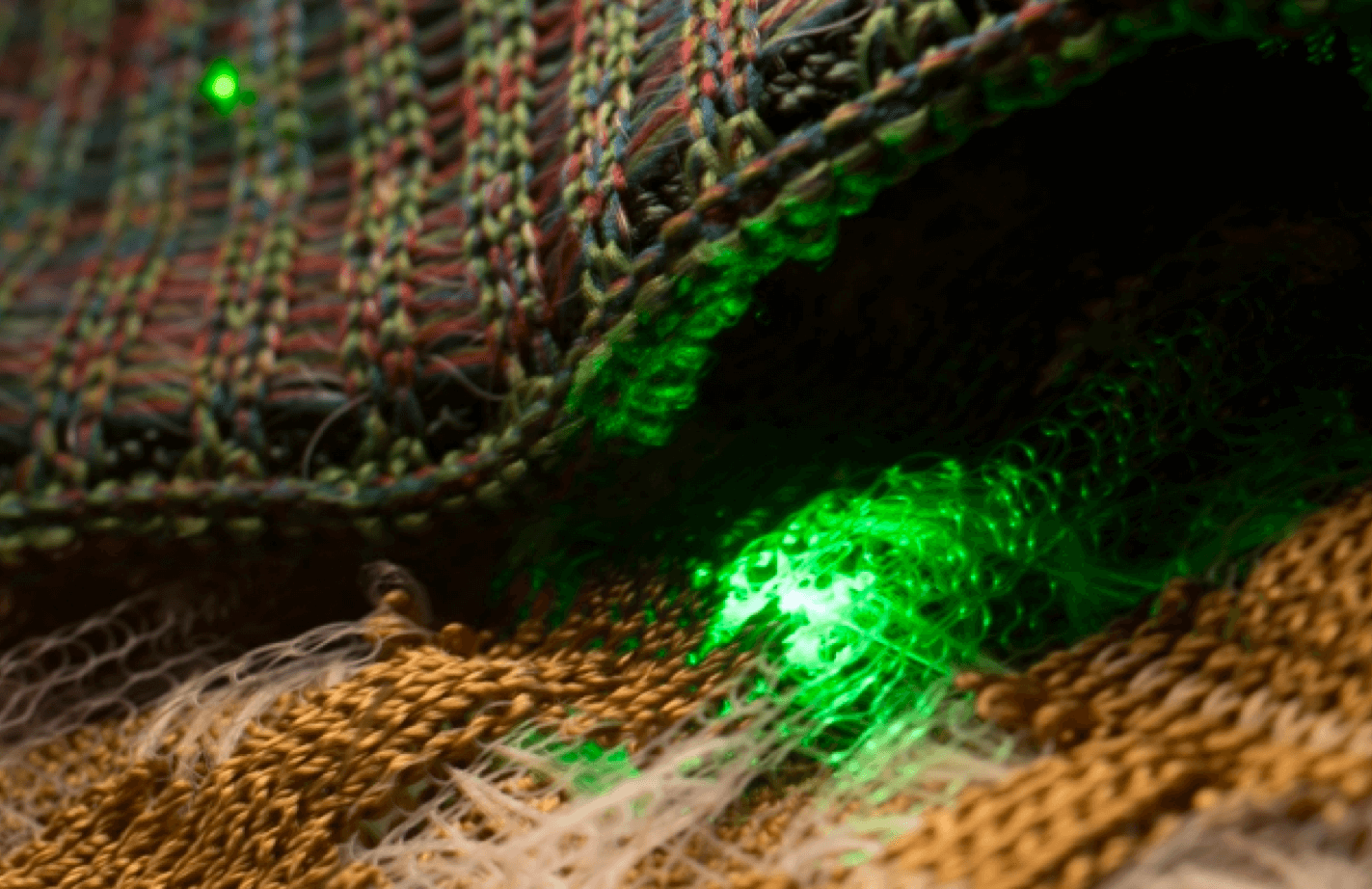 Thread and needle with a green light