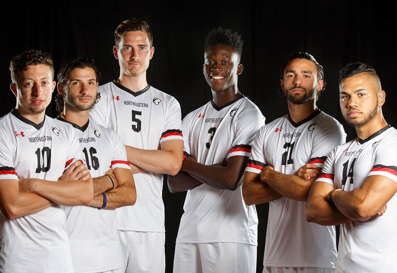 Members of Northeastern sport team in their uniforms.