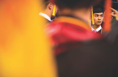 Multiple Northeastern students during graduation.