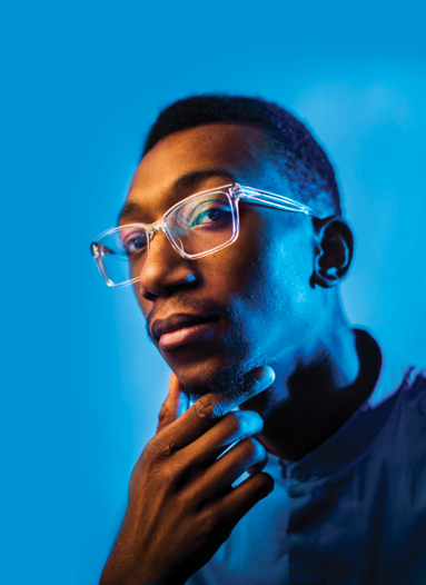 Student portrait on blue background.