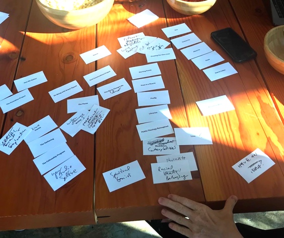 Paper cards with words scattered on a wodden table.